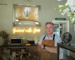 Baz Farrell stands behind the counter of the Courthouse Cafe in Alexandra. He and his wife, Becs,...