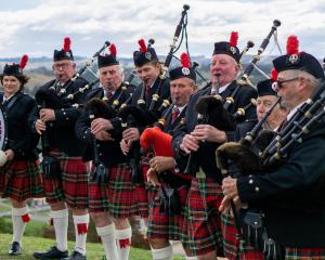 Playing atop Lookout Point are North Otago Highland Pipe Band members (from left): Priscilla...