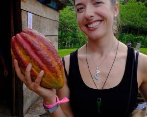 Elle Coco in Guatemala in 2018 with what she thinks might be the world’s largest cacao pod.