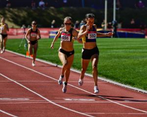 Becky Aitkenhead (4min 11.65sec) crosses the finish line ahead of Laura Nagel (4min 11.95sec) to...