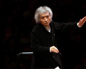 Seiji Ozawa conducting the Saito Kinen Orchestra in Britten's "War Requiem" at Carnegie Hall on...