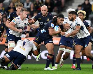 Tanielu Tele'a of the Highlanders charges forward during the round one Super Rugby Pacific match...