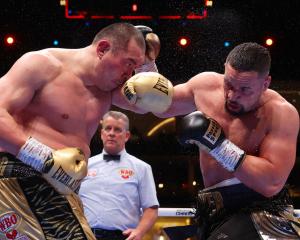 Zhilei Zhang and Joseph Parker exchange punches during their WBO Interim World Heavyweight title...