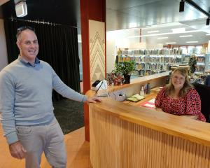Oxford Area School principal Mike Hart chats to morning receptionist Rachel Stagg in the new...