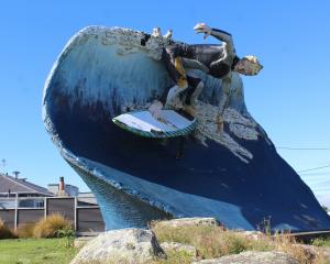 Colac Bay/Ōraka has been home to a giant surfer statue since 1999. In recent years, it has begun...