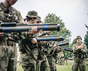 Private Lyndi Le Fay assists with the 66mm short range anti-armour weapon instruction during  New...