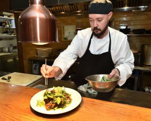 No 7 Balmac head chef Logan Wilson plates up. Photo: Gregor Richardson