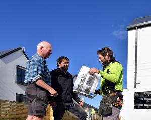 Leigh Pickford (left) and Stewart Construction managing director David Grant (centre) meet site...