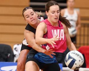 Steel wing attack Ella Southby holds her space for the ball against Tactix wing defence Greer...