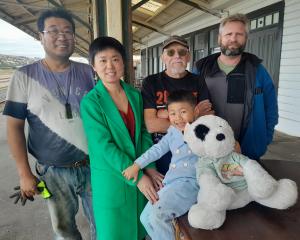 Oamaru Railway Station owners Jared Yuan and Tina Wang, with their son Jayden, 4, were happy for...