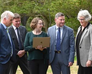 University of Otago Associate Prof Melanie Beres (centre) talks with Dunedin principals (from...