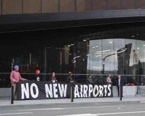 Sustainable Tarras members protest outside the Tourism Industry Aotearoa's national tourism...