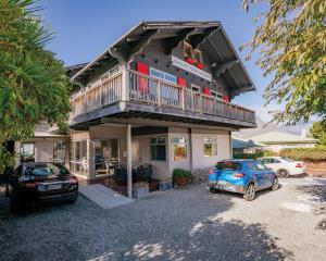 This central Queenstown visitor accommodation property is for sale by deadline private treaty....