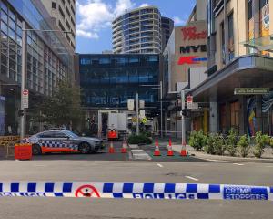 A police car is parked outside Westfield Bondi Junction Mall following Saturday’s stabbings in...
