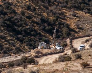 Santana Minerals contractors drilling near the historic "Come in Time'' battery site in 2022,...