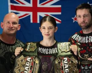 Cromwell athlete Shyla Mulholland, 14, with her martial arts coach Jason Magnago-Smith (left) and...
