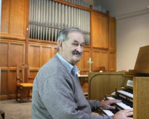 Baring Square Methodist Church parish steward Alister Smyth with the church’s new organ. Photo:...