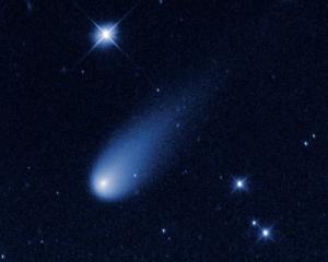 Comet ISON is captured hurtling toward the Sun in this time-lapse image made from a sequence of...