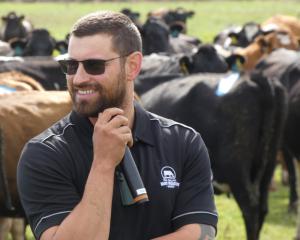 Southbridge contract milker Alan Robson da Veiga talks to farmers about his plans at a field day...