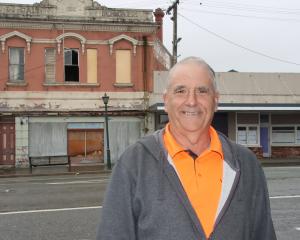 Living Well Mataura Church pastor Mike Whale stands in front of the Galt building and the...