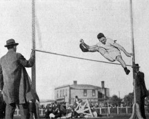 W. J. Scott clears  5 feet 6 inches on the high jump during an Otago University interfaculty...