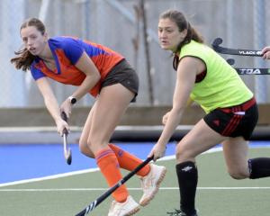 Billie Crowe (City Highlanders, left) flicks the ball past Kate Kersten (Momona A) at the King’s...