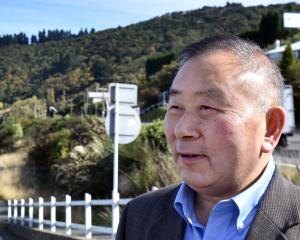 Harbourview Stadium Hotel owner Hu Zhang is concerned about how a temporary container storage...