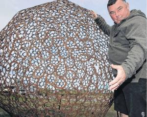 Damien Elley with his three metre high horse shoe ball. PHOTO: JOHN COSGROVE