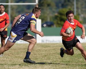 Halswell’s Iraia De Goldi looks to evade the tackle of Greymouth’s Harry Millar during their...