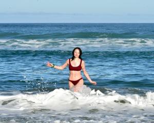Indi Mortimore, of Auckland, enjoys a patch of golden sunny weather in Dunedin yesterday by...