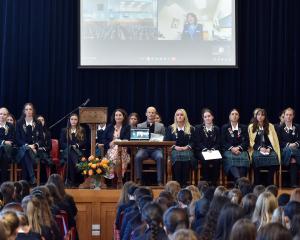 Otago Girls’ High School pupils listen to an announcement about a new prize from New Zealand...