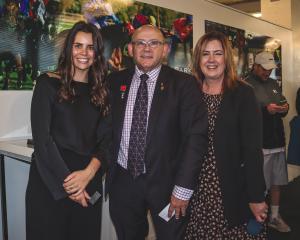 Courtney Dempster of Invercargill (left) with Invercargill Harness Racing Club president Craig...