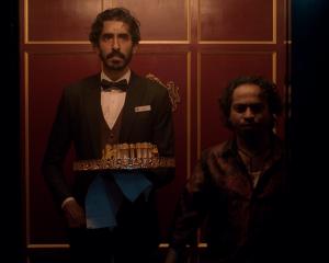 From left, Dev Patel is Kid and Pitobash is Alphonso in "Monkey Man", directed by Dev Patel....