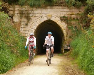 Cyclists emerge from a disused railway tunnel on the Alps 2 Ocean track. PHOTO: ODT FILES