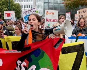 School Strike 4 Climate Co-Organiser Lucia Campbell-Reeves leads the march through central...