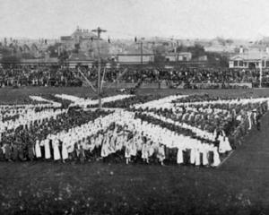 School children form a living flag of the Empire during a military pageant at Carisbrook, Dunedin...