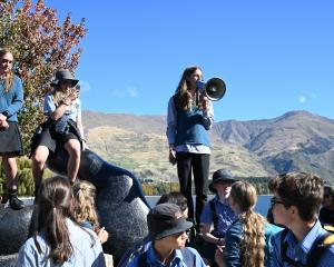 Mount Aspiring College pupil James Watson, 17, addresses a crowd of pupils over a megaphone at...