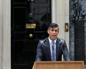 A saturated British Prime Minister, Rishi Sunak, delivers a speech calling for a general election...