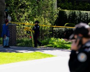 Police outside the Toronto mansion of Canadian rapper Drake after a security guard was shot....