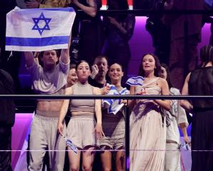 An Israeli delegation reacts to artist Golan's success in the second semi-final of the 2024&nbsp...