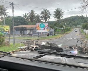 A road barricaded by rioters in Noumea, New Caledonia. Photo: Lilou Garrido Navarro Kherachi/via...