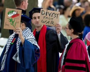 Graduates protest against the conflict between Israel and Hamas during the commencement at Yale...