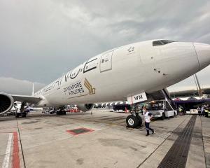 A Singapore Airlines aircraft is seen on tarmac after requesting an emergency landing at Bangkok...