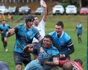 Ref Damon Smith signals a try to Wakatipu’s jubilant Timoci Naivaluwaqa in their game against...