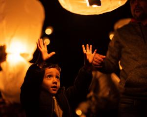 Joao Souza, then 5, of Queenstown, releases his lantern at Light Up Winter in Cromwell in 2023....