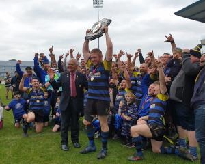 Invercargill Blues Captain Michael Peterson lifts the Galbraith Shield after his side beat Star...