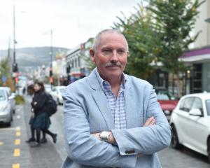 Dunedin city councillor Brent Weatherall stands in the Farmers block of George St, following the...