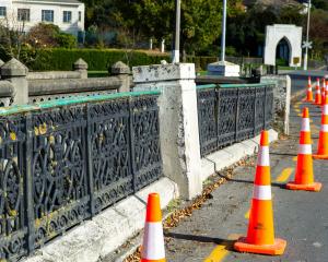Part of the Oamaru Creek bridge in Severn St has been coned off after being hit by a vehicle last...