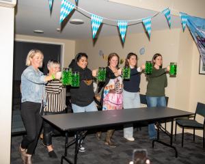 South Otago contestants try their luck stein-holding on one foot last Saturday at the Moss Cross...