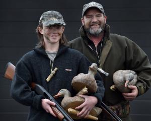 Ready for duck-shooting are Mason, 15, and Greg Hodge, of Mosgiel. PHOTO: PETER MCINTOSH